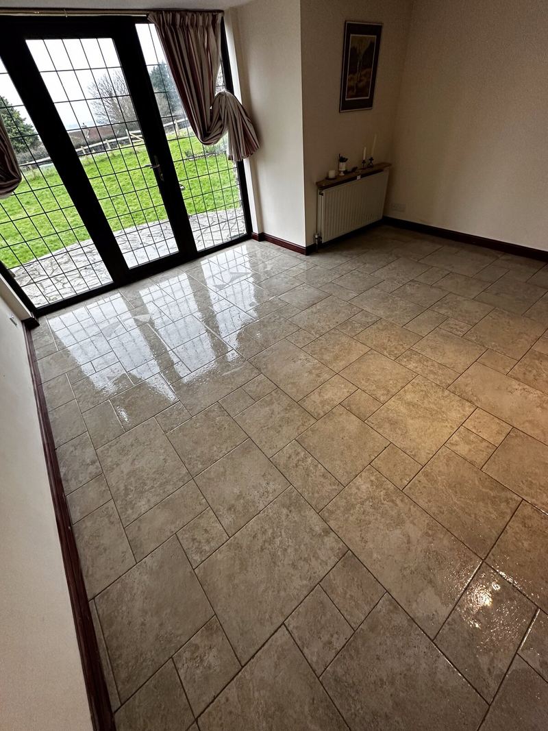 Living room in Plymouth with a polished porcelain floor laid in brick bond
